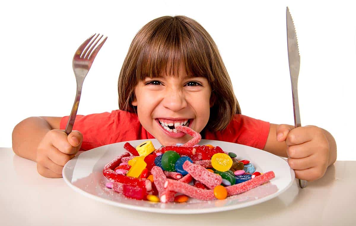 kid eating candy