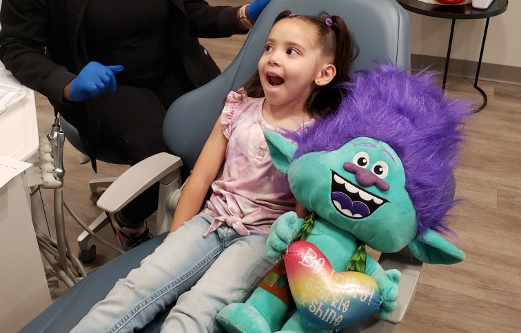 Smiling child during a dental checkup at Luna Pediatric Dentistry near Rosenberg, TX